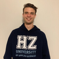 Civil Engineering student Jens poses in a sweater of HZ