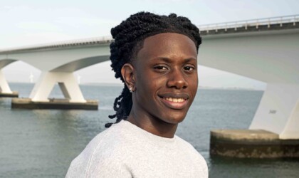 Civil Engineering student posing in front of the Zeelandbrug