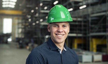 Portrait of an Industrial Engineering & Management student wearing a safety hat