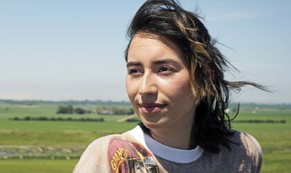 Water Management student in a green field in Zeeland, Netherlands