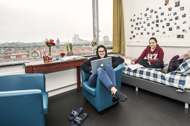 Students hanging out together in their student room