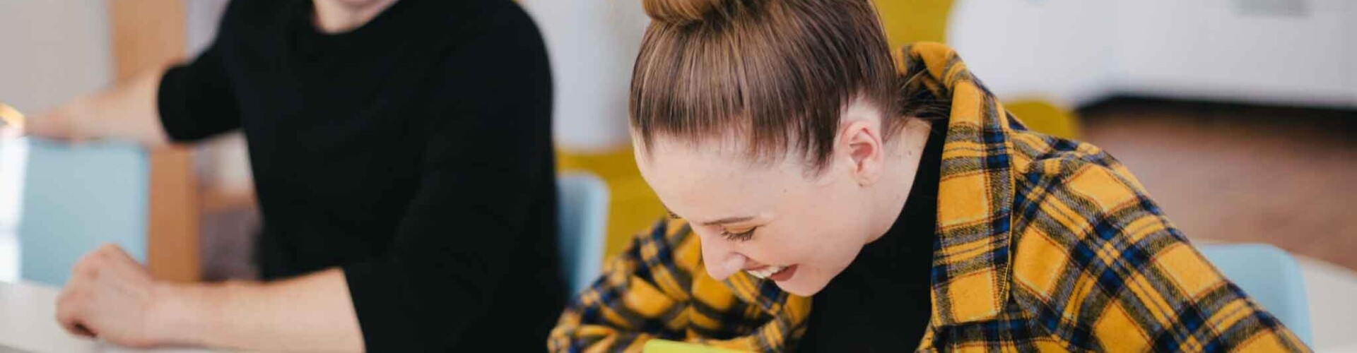 Student that is laughing with another student next to her
