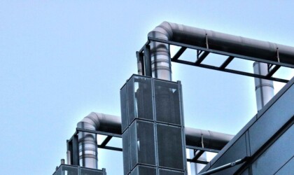 Industrial pipes coming out of a building