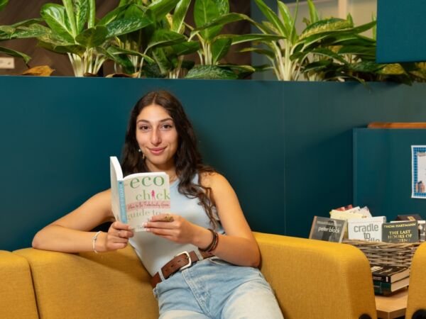 Student reading a book in the HZ Community Hub