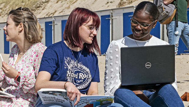 A group of students, who study abroad at HZ University of Applied Sciences in the Netherlands, studying at the beach in Vlissingen, Zeeland.