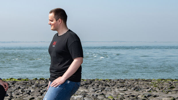 Two international IT students of HZ University of Applied Sciences standing on the beach in Vlissingen, Zeeland, The Netherlands